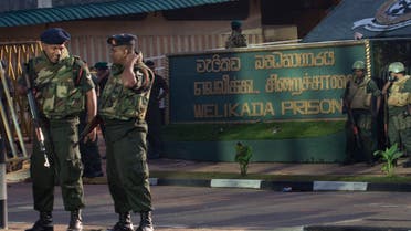 Army soldiers stand guard at the entrance of Welikada prison in Colombo, Sri Lanka, Saturday, Nov. 10, 2012. (AP)