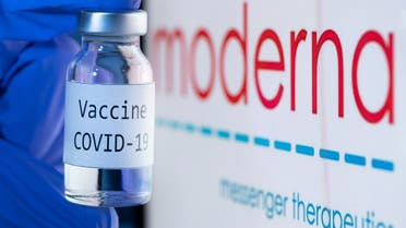 In this file photo taken on November 18, 2020 shows a bottle reading “Vaccine COVID-19” next to the Moderna biotech company logo. (Joel Saget/AFP)