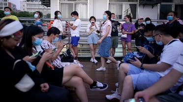 People use mobile phones on a boat sailing on Yangtze River following the coronavirus disease (COVID-19) outbreak, in Wuhan, Hubei province, China, September 3, 2020. (Reuters/Aly Song)