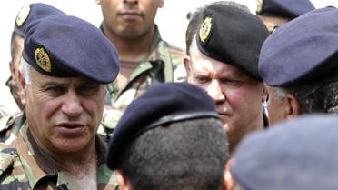 A file photo shows former Lebanese Army Forces Commander General Jean Kahwaji (L) during a visit to an army outpost in al-Adaysseh on the Lebanese-Israeli border on August 4, 2010. (AFP/Joseph Eid)
