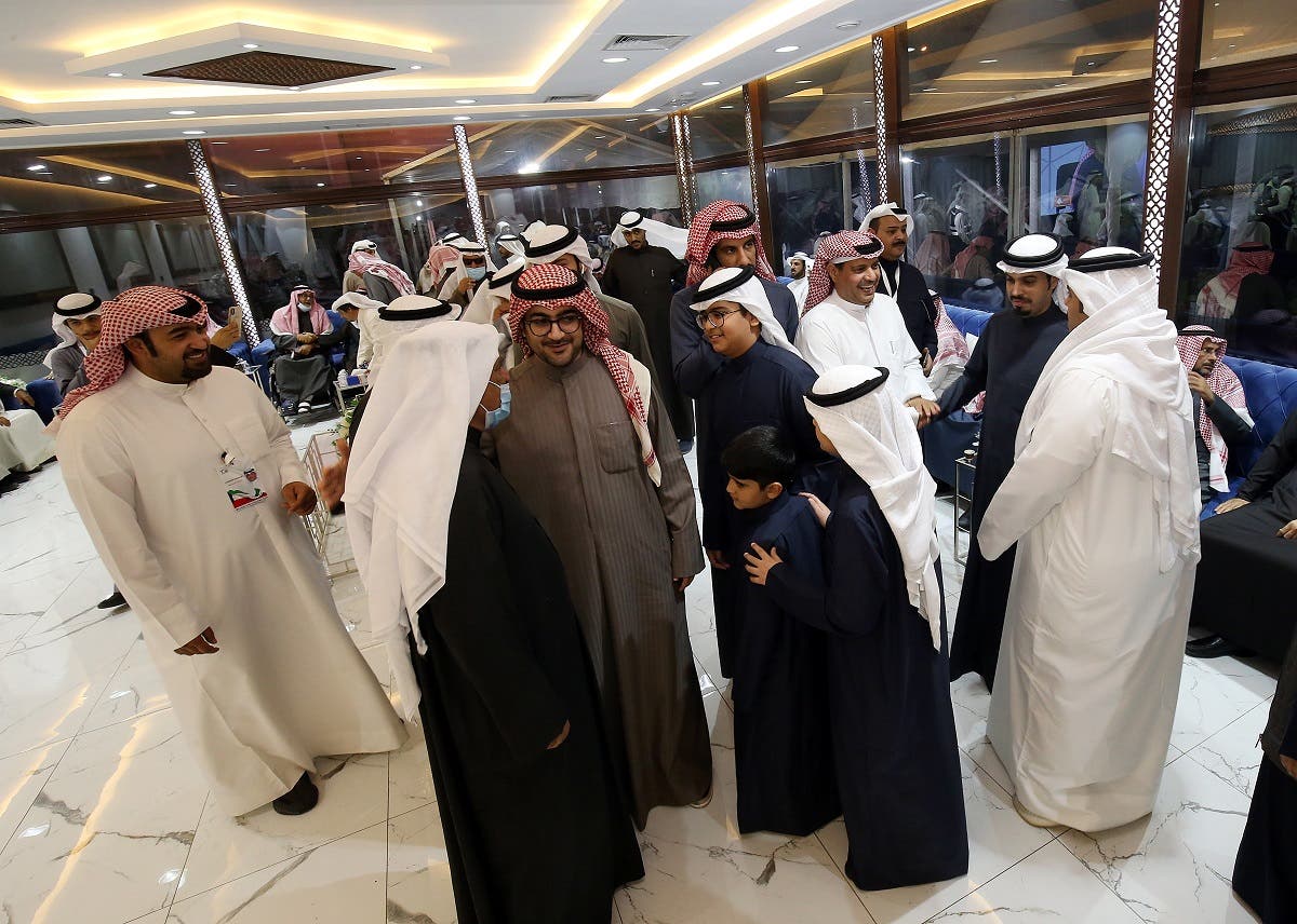 Kuwaitis attend an electoral campaign meeting ahead of the upcoming election scheduled for later in the week, in Kuwait City on December 2, 2020. (AFP)