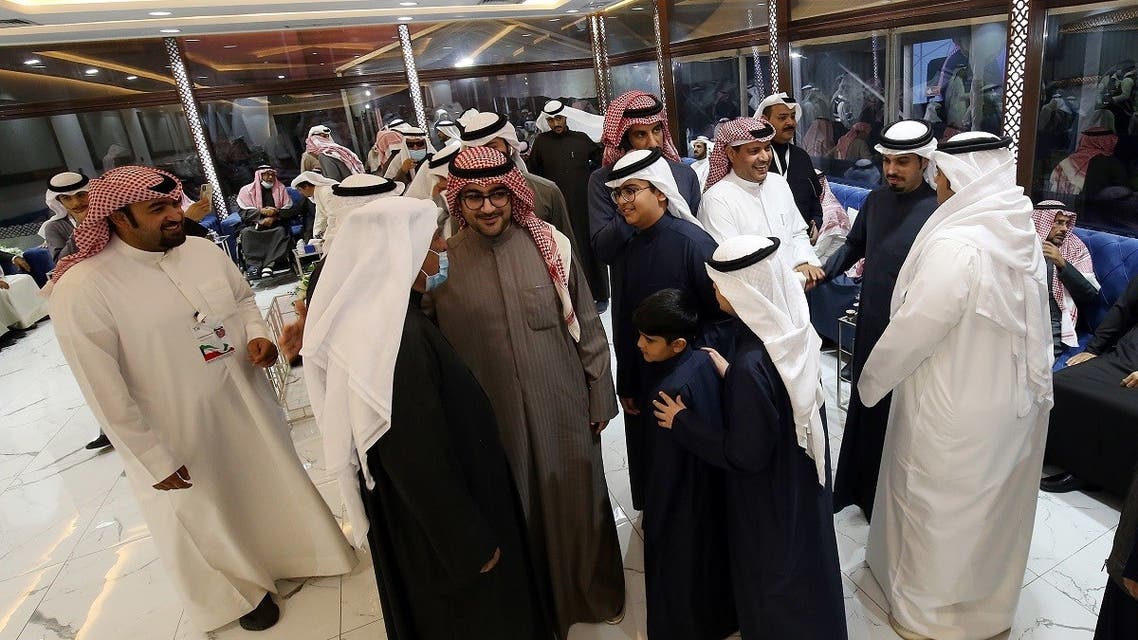 Kuwaitis attend an electoral campaign meeting ahead of the upcoming election scheduled for later in the week, in Kuwait City on December 2, 2020. (AFP)