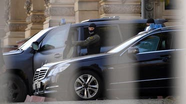 A file photo shows police officers guard in front of the federal court of Justice (BGH) in Karlsruhe where a terror suspect from Syria will stand trial, Germany, Wednesday, Nov. 1, 2017. (Uli Deck/DPA via AP) 