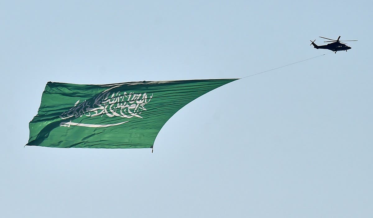 A military helicopter flies over Riyadh during celebrations marking Saudi Arabi's 90th National Day, Sept. 23, 2020. (AFP)