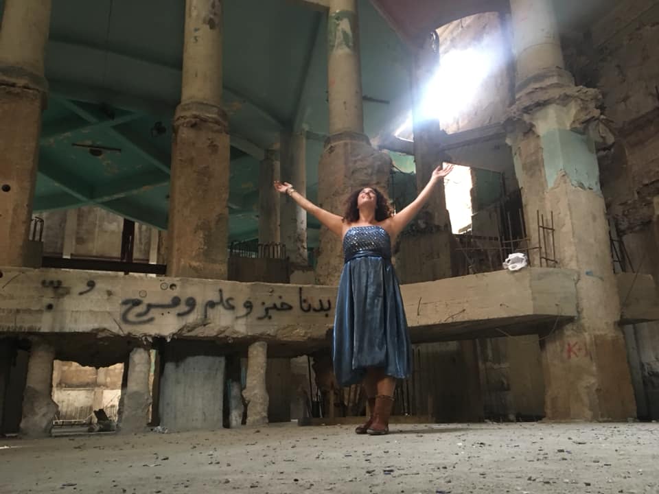 A still of Mona Hallab singing at the Grand Theatre during the Oct. 17 protests, filmed by Marie-Rose Osta. (Screengrab)
