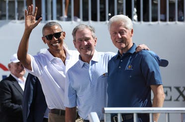 Former US Presidents (from Left) Barack Obama and George W. Bush and Bill Clinton smile during the first round foursomes match of The President's Cup golf tournament at Liberty National Golf Course.(Bill Streicher/USA TODAY)