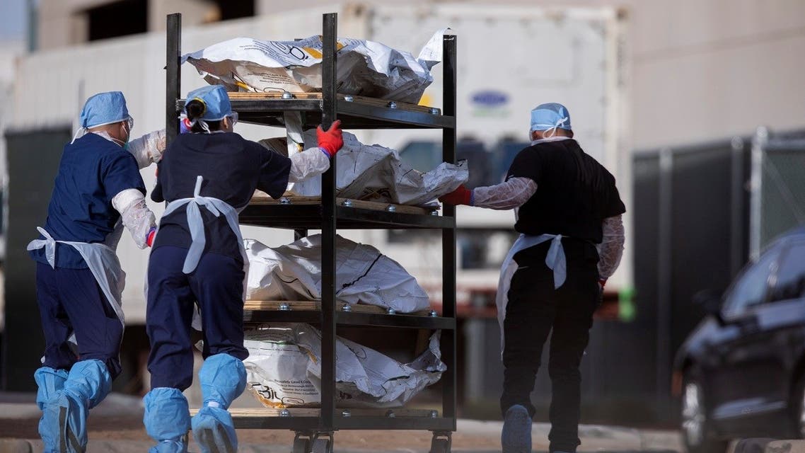 El Paso County Medical Examiner's Office staff move bodies in El Paso. (Reuters)