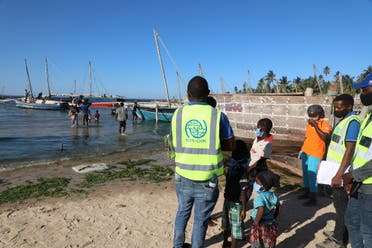 This handout picture taken on November 6, 2020 in Pemba, northern Mozambique, by IOM (International Organization for Migration) shows internally displaced people being assisted by the IOM Displacement Tracking Matrix (DTM) team. (Sandra Black/IOM/AFP)