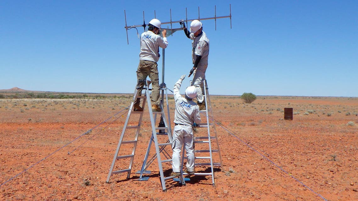 In this photo provided by JAXA, its crew members set up antenna in the preparation for the operation for the capsule collection in Woomera, South Australia in November, 2020. The Hayabusa2 spacecraft left the asteroid Ryugu, about 300 million kilometers (180 million miles) from Earth, a year ago and is expected to reach Earth and drop a capsule containing the precious samples in southern Australia on Dec. 6. (JAXA via AP)