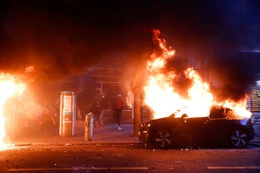 A car burns during a protest against the Global Security Bill'', that right groups say would make it a crime to circulate an image of a police officer's face and would infringe journalists' freedom in the country, in Paris. (Reuters)