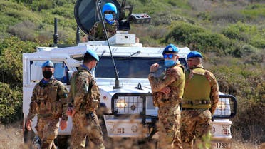 UN peacekeepers (UNIFIL) stand near a UN vehicle in Naqoura, near the Lebanese-Israeli border, southern Lebanon October 14, 2020. REUTERS/Aziz Taher