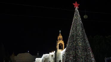 A picture taken on December 5, 2020, shows the Christmas tree after a lighting ceremony in the biblical city of Bethlehem in the occupied West Bank. (Reuters)