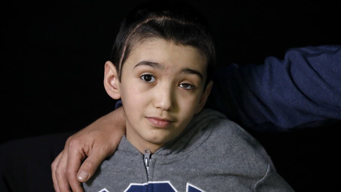 Malek Issa, 9, who lost his left eye in the ongoing conflict with Israel, poses during a photo session in Jerusalem on May 6, 2020. (Emmanuel Dunand/AFP)
