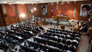 A general view of a courtroom shows suspected opposition supporters (in grey) attending a session in their trial at the revolutionary court in Tehran on August 25, 2009. (AFP)