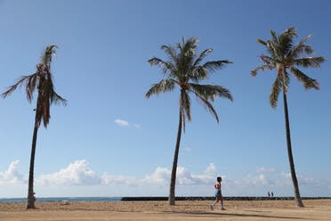 A beachgoer walks down Waikiki Beach, Thursday, Oct. 15, 2020, in Honolulu. (File photo: AP)