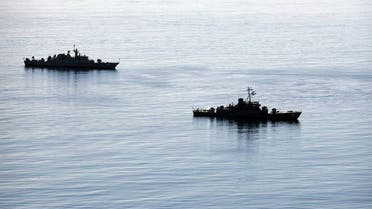 A handout photo made available by the Iranian Army office on December 27, 2019 shows a view of two warships during joint Iran-Russia-China naval drills in the Indian Ocean and the Gulf of Oman. (AFP)