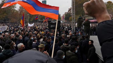 People attend an opposition rally to demand the resignation of Armenian Prime Minister Nikol Pashinyan following the signing of a deal to end a military conflict over Nagorno-Karabakh, in Yerevan, Armenia December 5, 2020. REUTERS/Artem Mikryukov