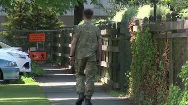 A uniformed military personnel walks outside of a coronavirus disease managed isolation quarantine facility at the DoubleTree by Hilton, in Christchurch, New Zealand in this still frame taken from video. (File photo: Reuters)