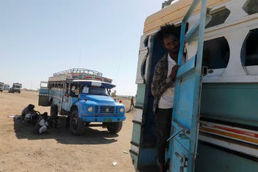An Ethiopian refugee looks out of a bus window which transports him from the Hamdeyat refugee transit camp, which houses refugees fleeing the fighting in the Tigray region, on the border in Sudan, December 1, 2020. (File photo: Reuters)