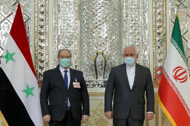 وزيرا خارجية إيران جواد ظريف، وسوريا فيصل المقداد