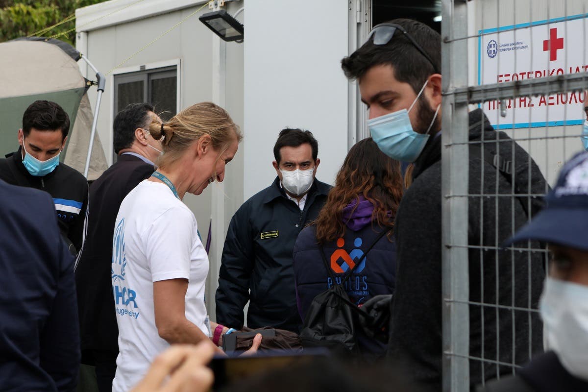 Greek Migration Minister Notis Mitarachi (C) visits the Moria camp for refugees and migrants, following the coronavirus disease (COVID-19) outbreak, on the island of Lesbos, Greece, May 3, 2020. (Reuters/Elias Marcou)