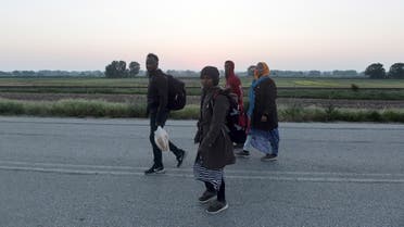 Somali refugees walk after they crossed the Evros river, the natural boundary with Turkey in northeastern Greece, in the village of Neo Cheimonio on April 28, 2018. (Sakis Mitrolidis/AFP)