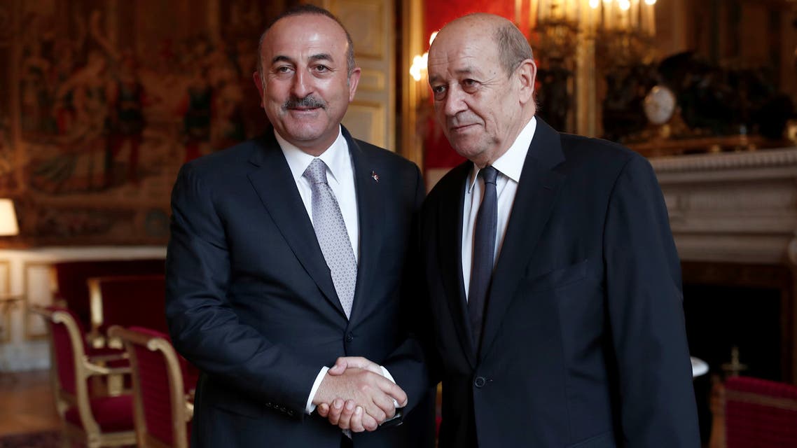French Minister for Foreign Affairs Jean Yves Le Drian and his Turkish counterpart Mevlut Cavusoglu, pose for the media prior to their bilateral meeting at the Quai d'Orsay in Paris, France, September 30, 2018. REUTERS/Benoit Tessier/Pool