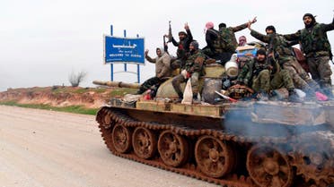 Syrian government soldiers on a tank hold up their rifles and flash victory sign on the M5 highway. (File Photo: AP)