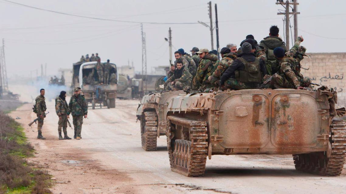 This photo released Wednesday February 5, 2020 by the Syrian official news agency SANA, shows Syrian government forces entering the village of Tel-Toukan, in Idlib province, northwest Syria. (SANA via The Associated Press)