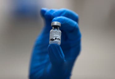 A nurse holds a phial of the Pfizer-BioNTech COVID-19 vaccine at Guy's Hospital in London, Tuesday, Dec. 8, 2020. (AP)