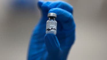 A nurse holds a phial of the Pfizer-BioNTech COVID-19 vaccine at Guy's Hospital in London, Tuesday, December 8, 2020. (The Associated Press)