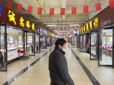 Shops are seen ope almost a year after the start of the coronavirus outbreak, in Wuhan, Hubei province. (File photo: Reuters)