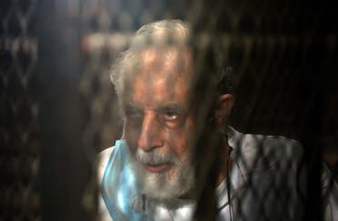 Mahmud Ezzat, the Muslim brotherhood group acting leader, during his first session in his trial . (AFP)