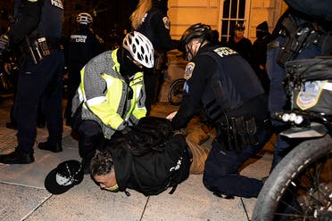 Washington DC Police arrest a member of the Proud Boys near Black Lives Matter Plaza on December 12, 2020 in Washington, DC. (AFP)