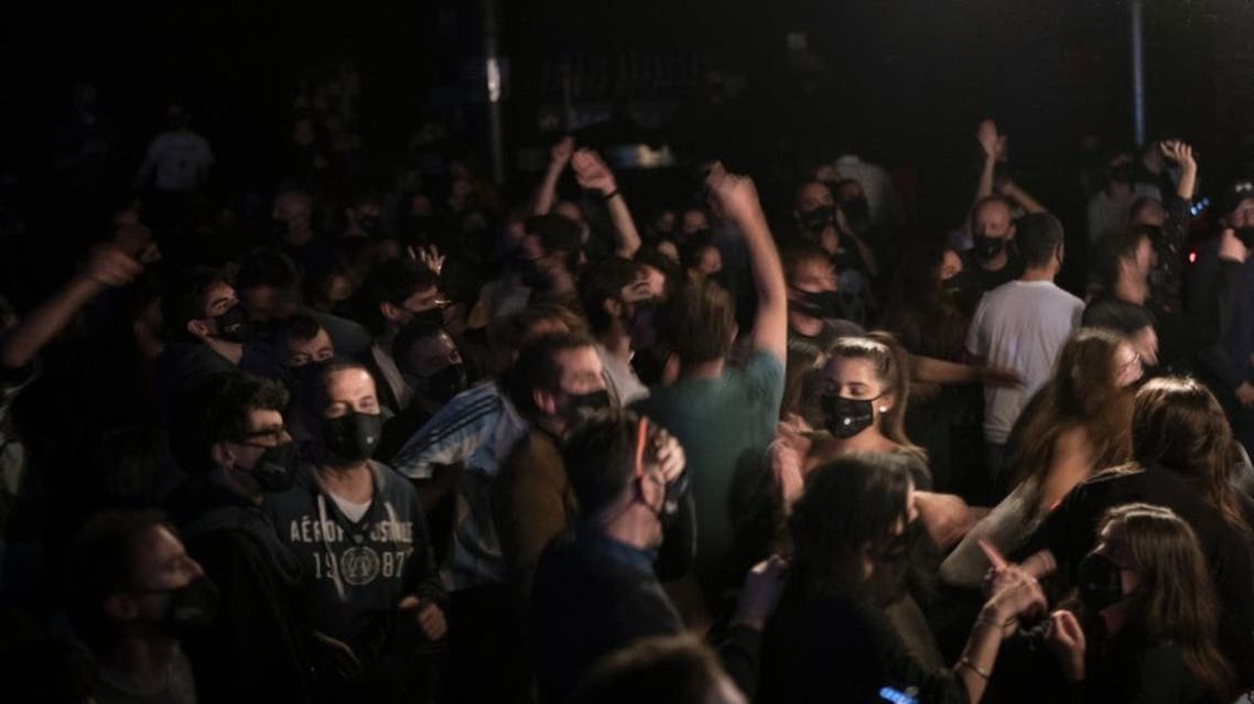 Over 1,000 Barcelona residents gather to participate in a medical study to evaluate the effectiveness of same-day coronavirus screening to safely hold cultural events. (AP)