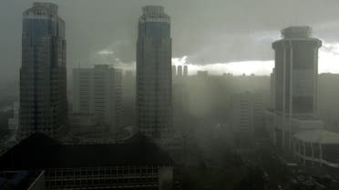 Low clouds obscure the Jakarta's skyline during a heavy rain April 11, 2006. (Reuters)