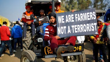 Farmers arrive in a tractor to attend a protest against the newly passed farm bills at Singhu border near New Delhi, India, on December 14, 2020. (Reuters)
