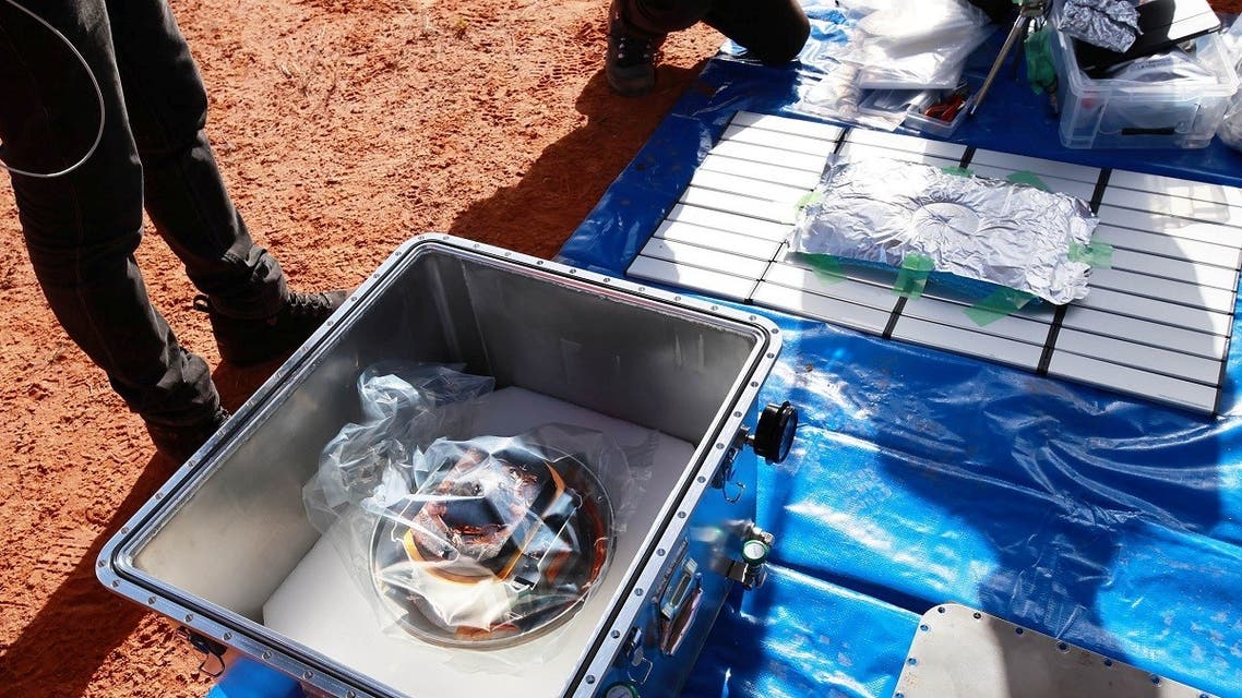 Hayabusa2’s capsule carrying the first extensive samples of an asteroid is seen after collecting them, in the Woomera restricted area, Australia, December 6, 2020. (Reuters)