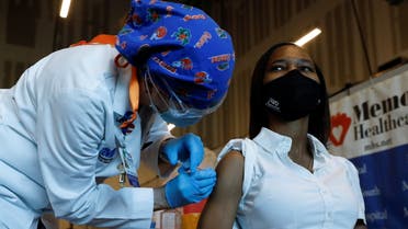 Nurse Cheryl Birmingham administers the Pfizer-BioNTech COVID-19 Vaccine to registered nurse La Tanya Forbes at Memorial Healthcare System facility in Miramar, Florida, US, December 14, 2020. (Reuters)
