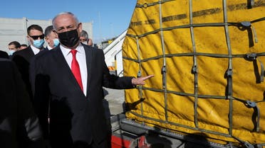 Israeli Prime Minister Benjamin Netanyahu attends the arrival of a DHL plane carrying Pfizer/BioNTech COVID-19 vaccine at Ben Gurion Airport near Tel Aviv, Israel on December 9, 2020. (Reuters)