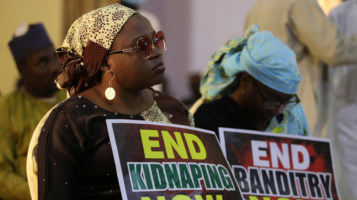 Document Date: 17 December, 2020 A demonstrator holds a sign during a protest to urge authorities to rescue hundreds of abducted schoolboys, in northwestern state of Katsina, Nigeria, December 17, 2020. REUTERS/Afolabi Sotunde