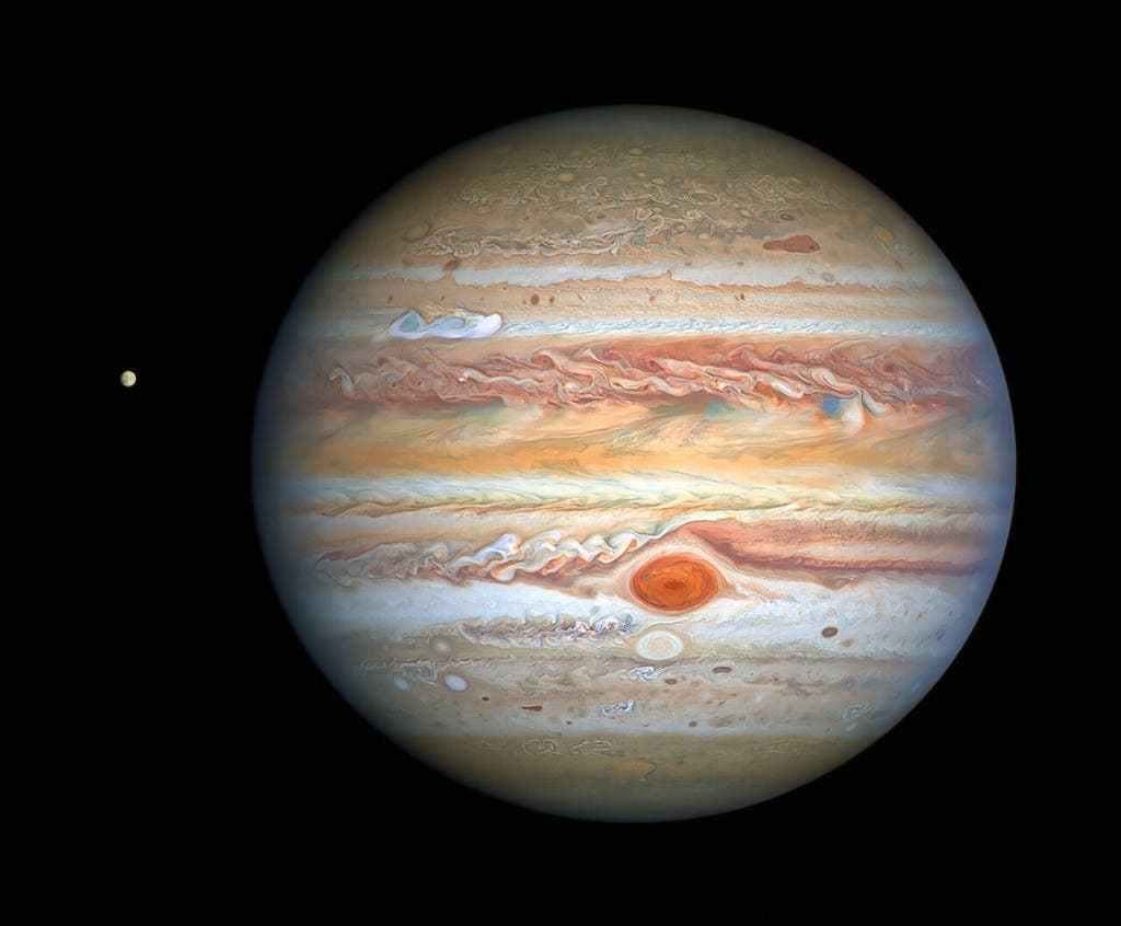 This handout photograph obtained on September 17, 2020 and released by NASA/ESA Hubble Space Telescope shows Jupiter and its moon Europa. (File photo: NASA/ESA/Hubble/AFP)