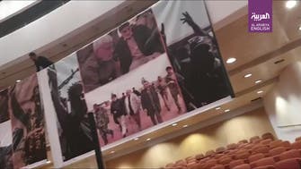 Watch: Posters of Soleimani, al-Mohandes hoisted inside Iraq’s parliament