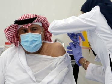A Saudi man gets a dose of a coronavirus disease (COVID-19) vaccine, in Riyadh, Saudi Arabia. (Reuters)