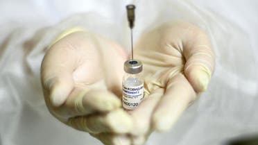 A nurse shows the Sputnik V (Gam-COVID-Vac) vaccine against the coronavirus disease (COVID-19) at a clinic in Moscow on December 5, 2020. (AFP)