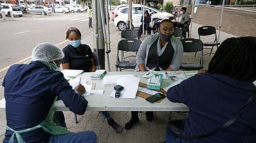 City of Tshwane health professional conduct screening exercises on people before testing for the COVID-19 coronavirus in Pretoria on December 17, 2020. (AFP)