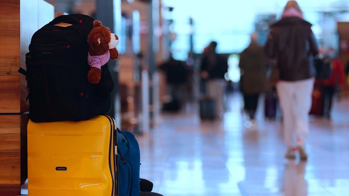 A woman waits at the Berlin Brandenburg airport, as EU countries begin closing their doors to travelers from the United Kingdom amid alarm about a rapidly spreading strain of coronavirus, in Schoenefeld, Germany, December 21, 2020. (Reuters)