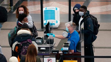 Travellers head through the north security checkpoint in the terminal of Denver International Airport early Thursday, Dec. 10, 2020, in Denver. (AP)