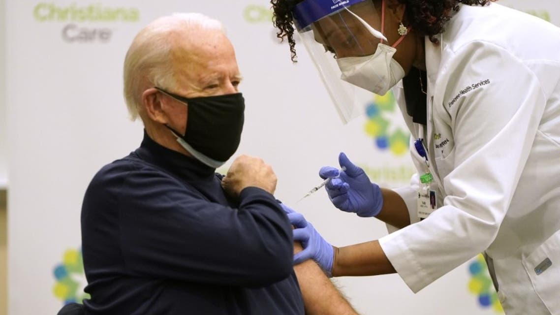 President-elect Joe Biden (L) receives a COVID-19 Vaccination from nurse practitioner Tabe Masa at ChristianaCare Christiana Hospital on December 21, 2020 in Newark, Delaware. (AFP)