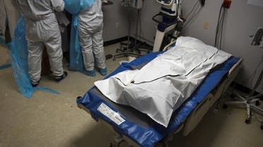 A patient who died lays in a body bag inside a coronavirus disease (COVID-19) unit at United Memorial Medical Center as the United States nears 300,000 COVID-19 deaths, in Houston, Texas, U.S., December 12, 2020. (Reuters)
